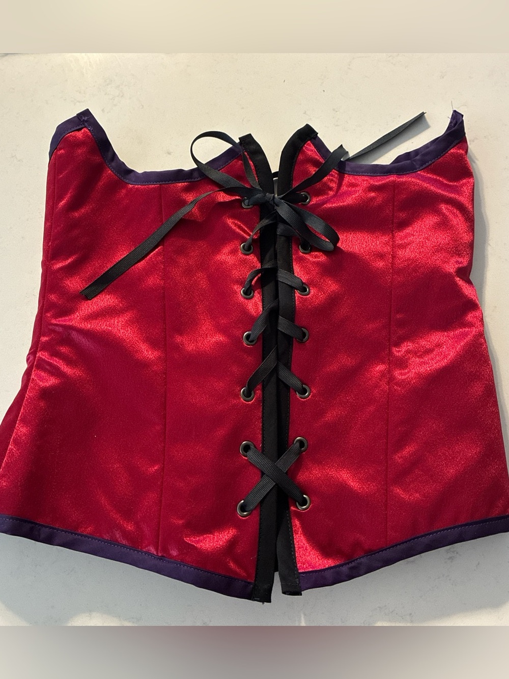 Red shiny underbust corset with purple lining & purple & black trim